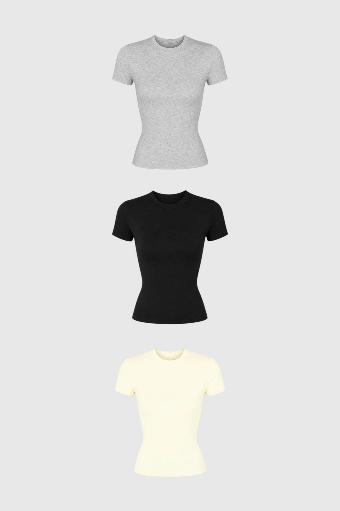 Kit com 3 baby tees LA MAGIE | Roupas Femininas Básicas e Estilosas em algodão nas cores cinza, preta e off-white.