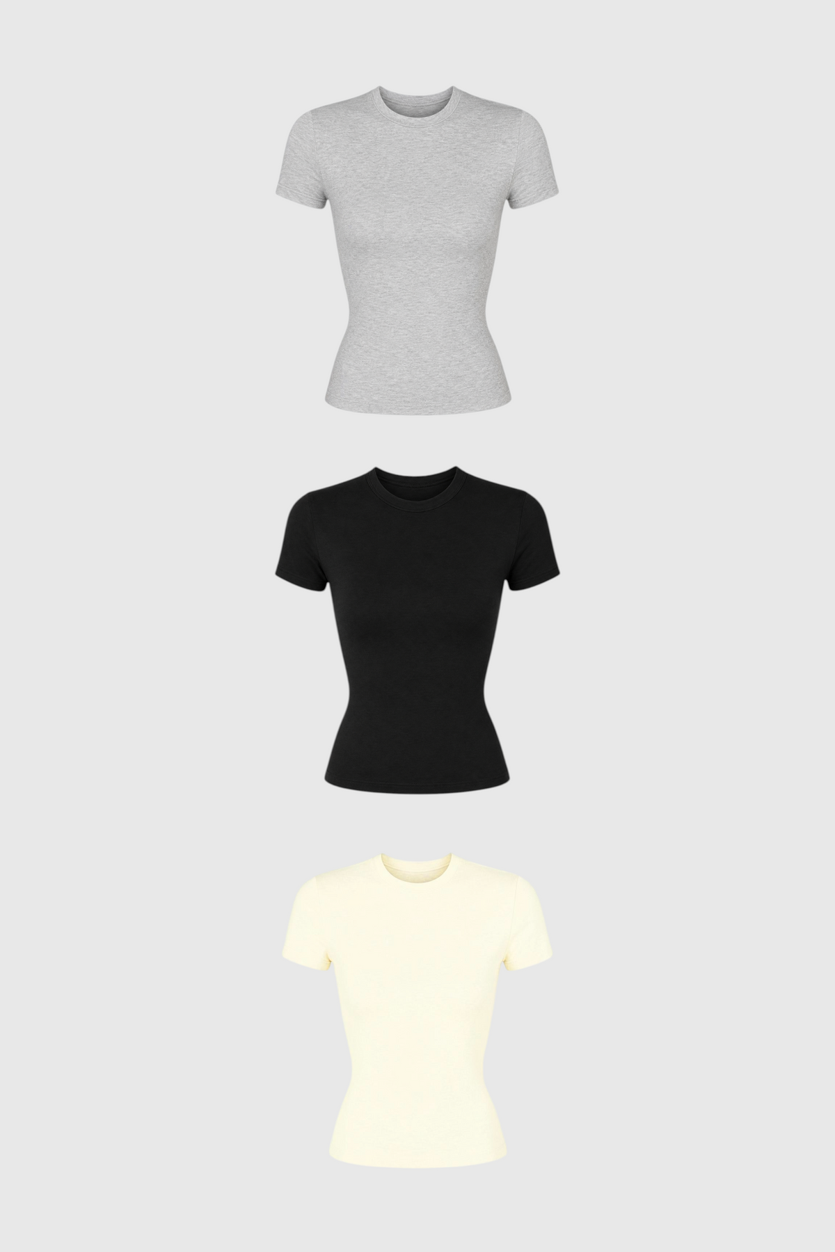 Kit com 3 baby tees LA MAGIE | Roupas Femininas Básicas e Estilosas em algodão nas cores cinza, preta e off-white.