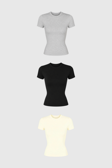 Kit com 3 baby tees LA MAGIE | Roupas Femininas Básicas e Estilosas em algodão nas cores cinza, preta e off-white.