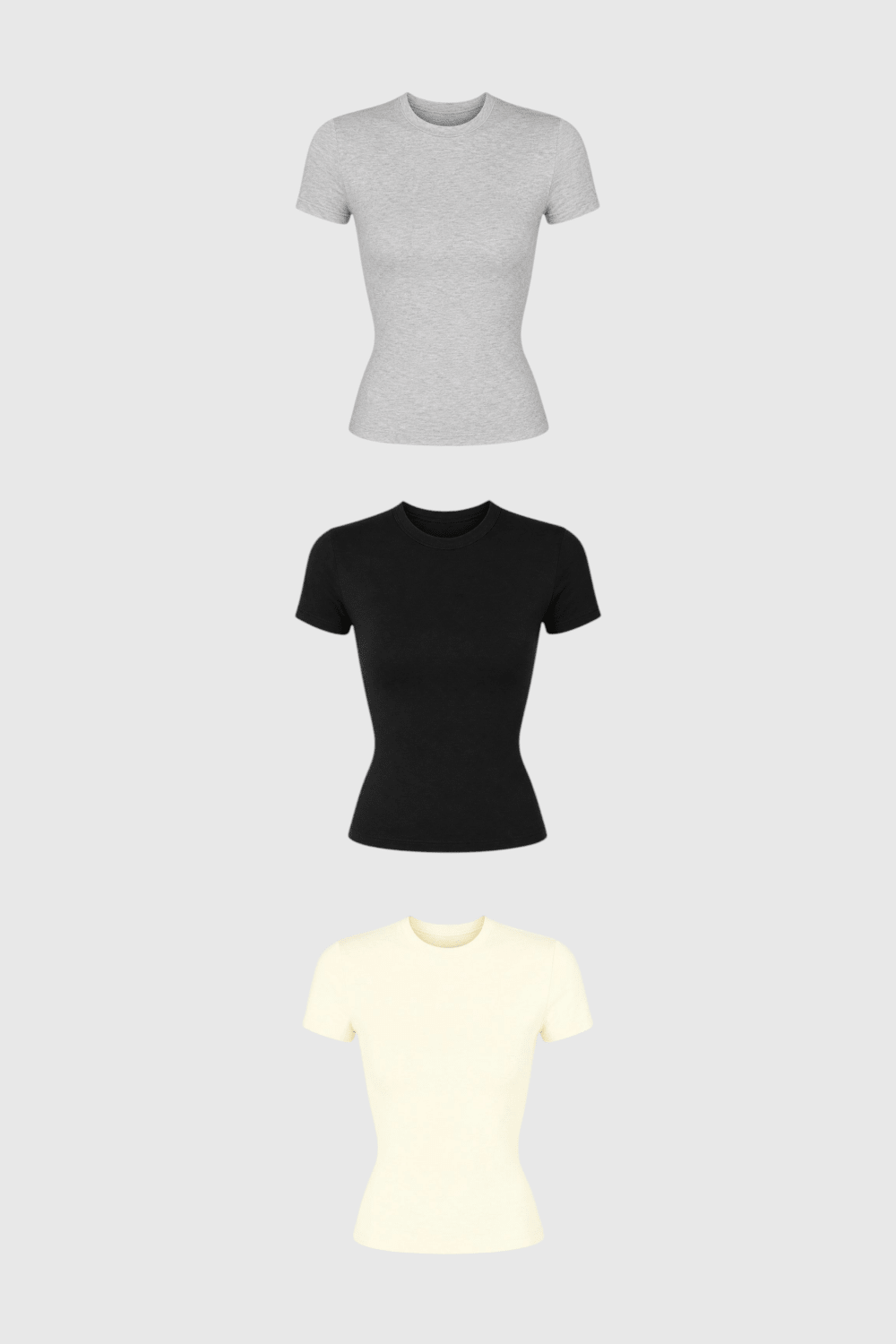 Kit com 3 baby tees LA MAGIE | Roupas Femininas Básicas e Estilosas em algodão nas cores cinza, preta e off-white.